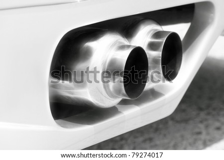 exhaust of a sports car- pollution concept