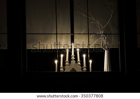 Advent lights in the window at night