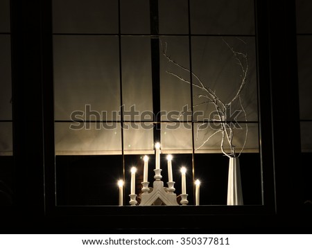 Advent lights in the window at night