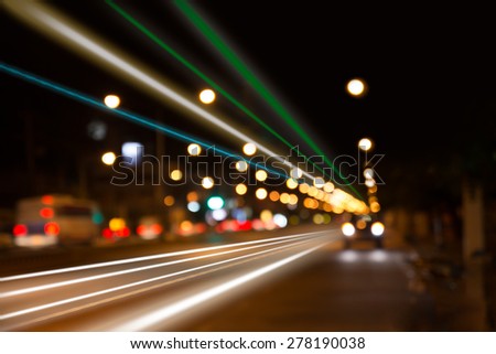 night traffic lights at intersection. The city lights. Motion blur. Abstract background
