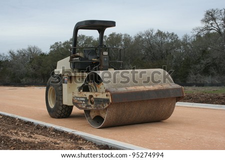 Steam Roller on road that is under construction