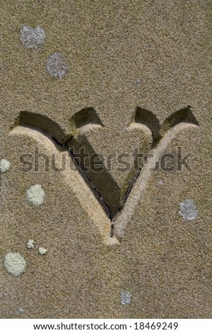 A found letter, part of an entire alphabet, carved in stone in an English churchyard. Suitable for use as part of a headline or as a drop capital at the beginning of a paragraph.