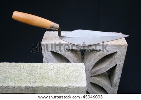 Bricklaying trowel on block.
