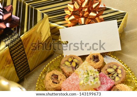 Empty tag with gifts and sweet
