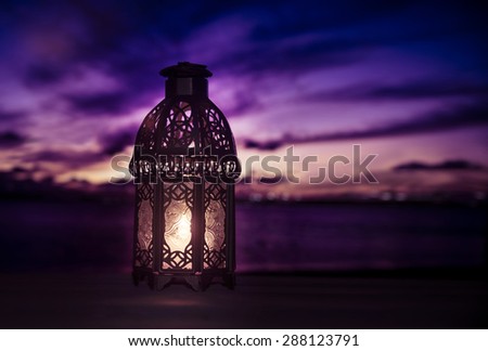 A lit up ramadan lamp against serene and beautiful evening sky. Ramadan background.