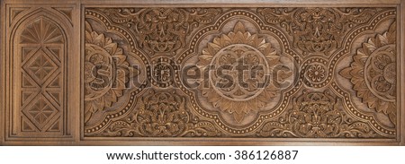 Intricate islamic wood crafted design. Islamic design carved on wooden panel.