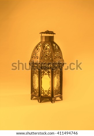 A colorful graphic design of a ramadan lantern. \'Ramadan Kareem\' - A  graphic greeting card cover.