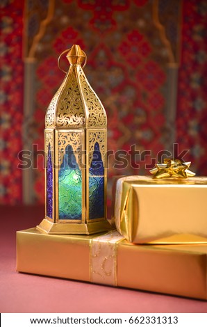 Special Eid gift and Ramadan Lantern. Islamic custom of celebrating festival by giving away gifts and sweet.