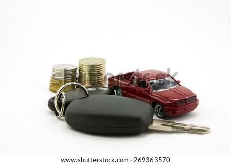 Car keys and toy car and money   isolated on white background