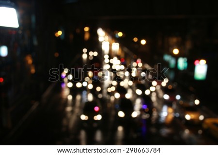bokeh of traffic light in raining night of Bangkok