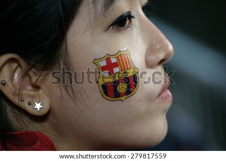 BANGKOK,THAILAND-AUGUST 7:Fan of FC Barcelona wating at outside the stadium for the friendly match Thailand National Team and FC Barcelona at Rajamangala Stadium on August 7,2013 in,Thailand.