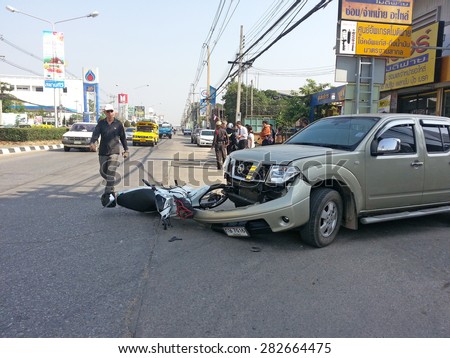 CHIANGMAI, THAILAND - JANUARY 10, 2013: Crash Accident Pickup Truck with Motorcycle at roadside in Chiangmai, Northern Thailand.