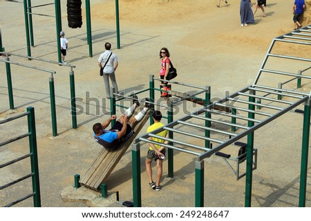 Samara, Russia - August 23, 2014: strangers on the Playground exercise in Samara, Russia - August 23, 2014.