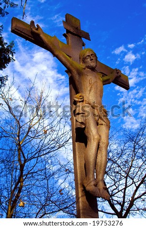 Look on cross with Jesus and blue sky