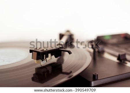 Detail of arm with cartridge on record player for LP vinyl discs