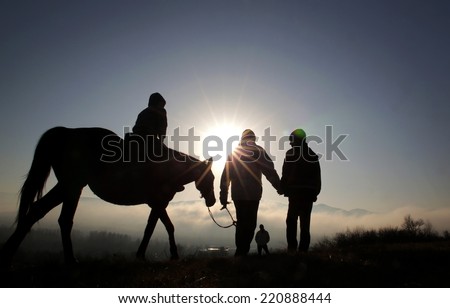 Sofia, Bulgaria - December 29, 2013: A child on a horse is led by his father in the Vitosha mountain near Sofia, Bulgaria.