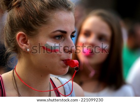 Sofia, Bulgaria - July 20, 2013: A girl is blowing a whistle at a protest against the Bulgarian government.