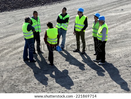 Sofia, Bulgaria - October 24, 2012: Engineers are discussing a highway project on the road construction site at one of the entrances of Sofia.