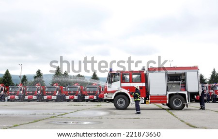 Sofia, Bulgaria - May 31, 2014: New fire trucks are presented to their firefighters in a field next to the main Fire department administrative building in Sofia.