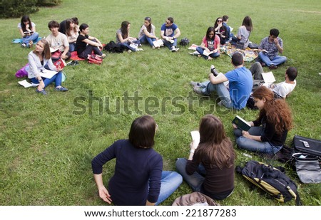 Sofia, Bulgaria - May 11, 2012: Student are reading in a park in front of their university. The initiative is willing to show the society that the students are motivated to study hard.