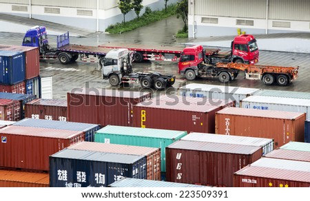 Chengdu, China - August 9, 2014: Cargo containers at the Chengdu\'s Europe express rail are being prepared for shipping worldwide.
