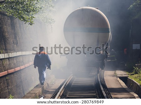 Petrol tanker train is seen in smoke near Sofia, Bulgaria. Fire safety service at Fire department is training in a train crash with spilled toxic and flammable materials from the cargo tanks.