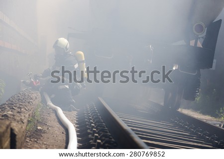Firefighters are extinguishing chemical cargo train tanks near Sofia. Teams from Fire department are participating in an emergency training with spilled toxic and flammable materials.