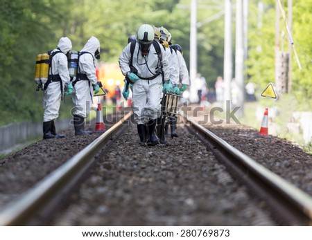 A team working with toxic acids and chemicals is approaching a chemical cargo train crash near Sofia, Bulgaria. Teams from Fire department are participating in a training with spilled toxic materials.
