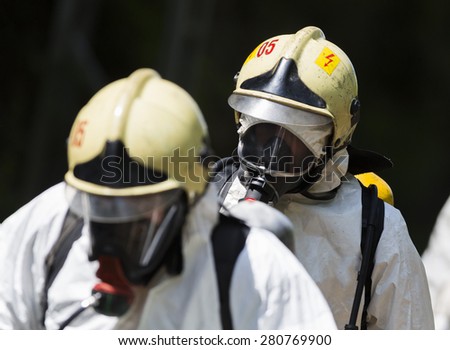 A team working with toxic acids and chemicals is approaching a chemical cargo train crash near Sofia, Bulgaria. Teams from Fire department are participating in a training with spilled toxic materials.