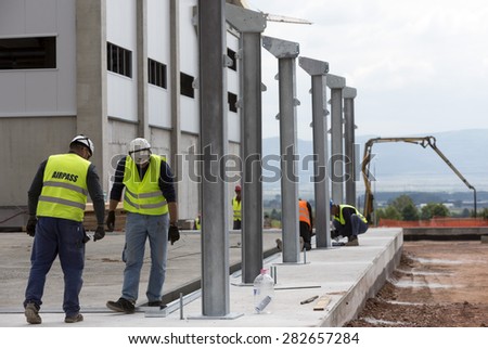 Sofia, Bulgaria - May 29, 2015: Workers are finalizing the construction of Sofia\'s second waste plant (organic waste plant, waste to energy, composting, incineration, landfill, recycling, windrow).