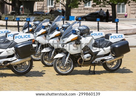 New police motorcycles in line with helmets on them.