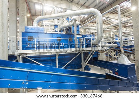 Sofia, Bulgaria - September 14, 2015: Inside of a waste management facility. Treatment and disposal of waste. Prevention of waste production through in-process modification, reuse and recycling.
