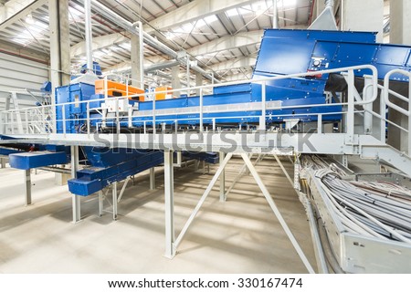Sofia, Bulgaria - September 14, 2015: Inside of a waste management facility. Treatment and disposal of waste. Prevention of waste production through in-process modification, reuse and recycling.
