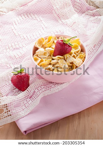 Corn flakes with strawberry for breakfast