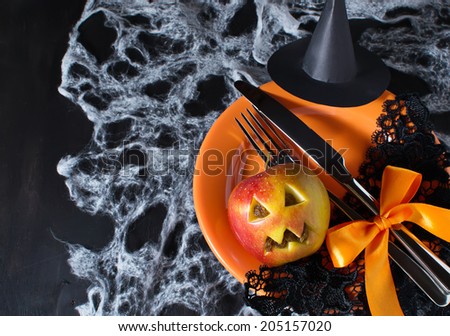 Halloween table setting with witch hat