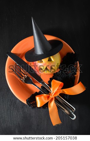 Halloween table setting with witch hat