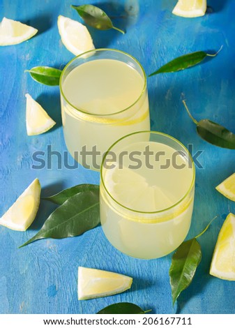 Citrus lemonade with lemons on a blue background