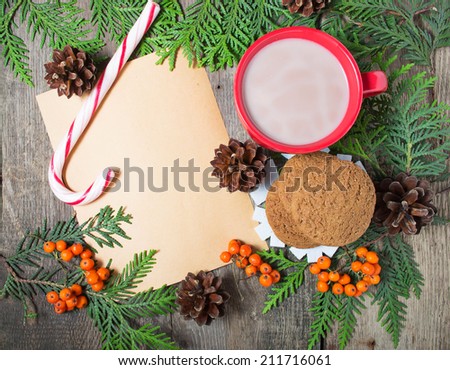 Christmas card with cup of cocoa, cookies, fir tree and pine cones.