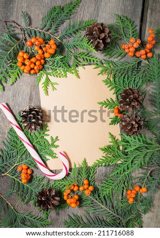 Blank christmas greeting card with fir tree, pine cones and rowan.