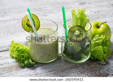 Green fresh smoothie with kiwi, apple, salad and broccoli, healthy drink. Selective focus