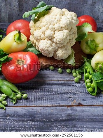 Fresh vegetable - cauliflower, tomatoes, peas, peppers, parsley. Selective focus