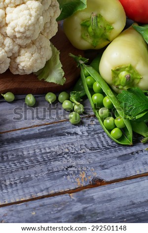 Fresh vegetable - cauliflower, tomatoes, peas, peppers, parsley. Selective focus