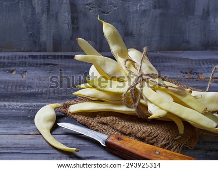 Fresh yellow beans in wooden table. Selective focus