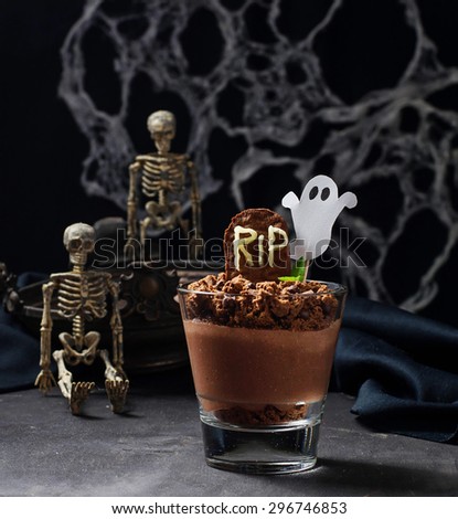 Halloween dessert with tombstone and ghost. Selective focus