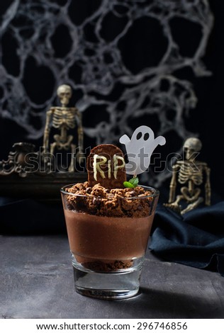 Halloween dessert with tombstone and ghost. Selective focus