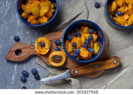 Process of preparation crumble with apricot and blueberry.  Selective focus