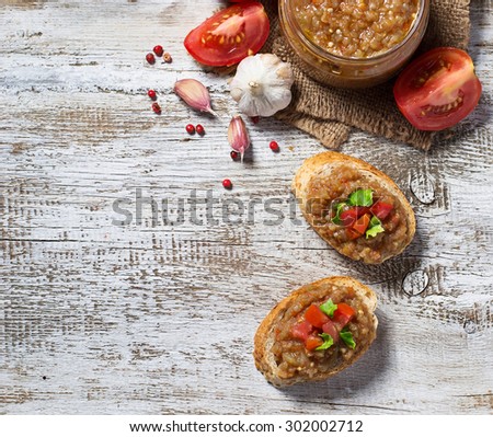 Bread toasts with eggplant caviar. Selective focus, space for text