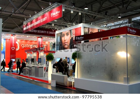 HANNOVER, GERMANY - MARCH 10: stand of McAfee on March 10, 2012 in CEBIT computer expo, Hannover, Germany. CeBIT is the world\'s largest computer expo