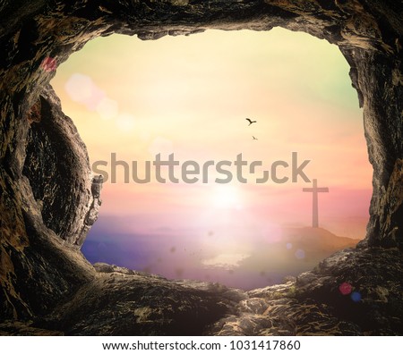 Empty tomb with cross on mountain sunrise background