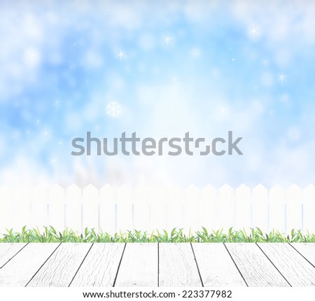 White wooden paving with white fence and blurred winter background